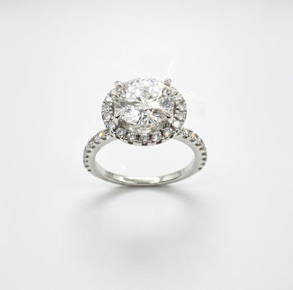 950 Platinum Round Brilliant Diamond With Hidden Diamond Basket And Diamond Halo And Shoulder Ring