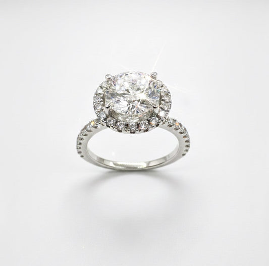 950 Platinum Round Brilliant Diamond With Hidden Diamond Basket And Diamond Halo And Shoulder Ring