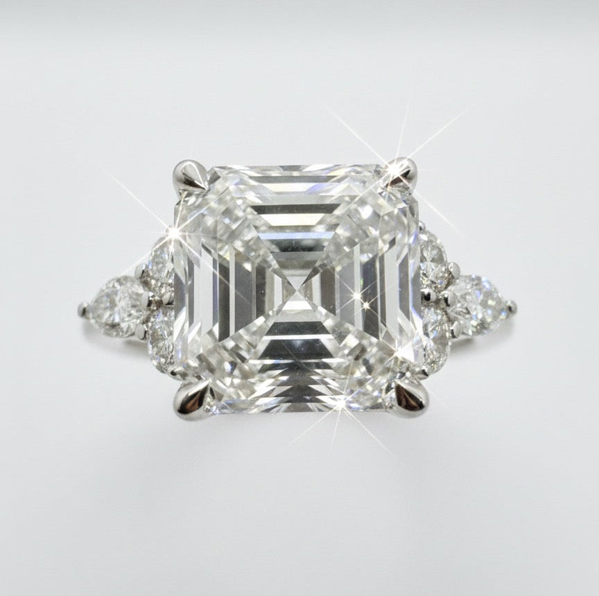 950 Platinum Asscher Cut Diamond With Round Brilliant And Marquees Diamond Shoulder Ring.